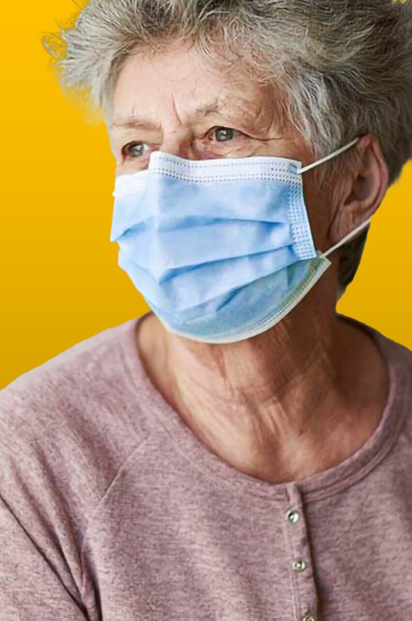 elderly woman in mask on gold background